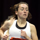  Local track star Bridget Dahlberg of South Newton High School on her way to a fifth place finish in the Junior Invite Mile.