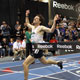  Joshua Brown raises his arms rejoices at winning the Master’s Mile.