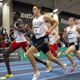  Charlie Dewie of Providence and Dey Tuach of Rend Lake College lead down the homestretch in the College Men’s 800m.